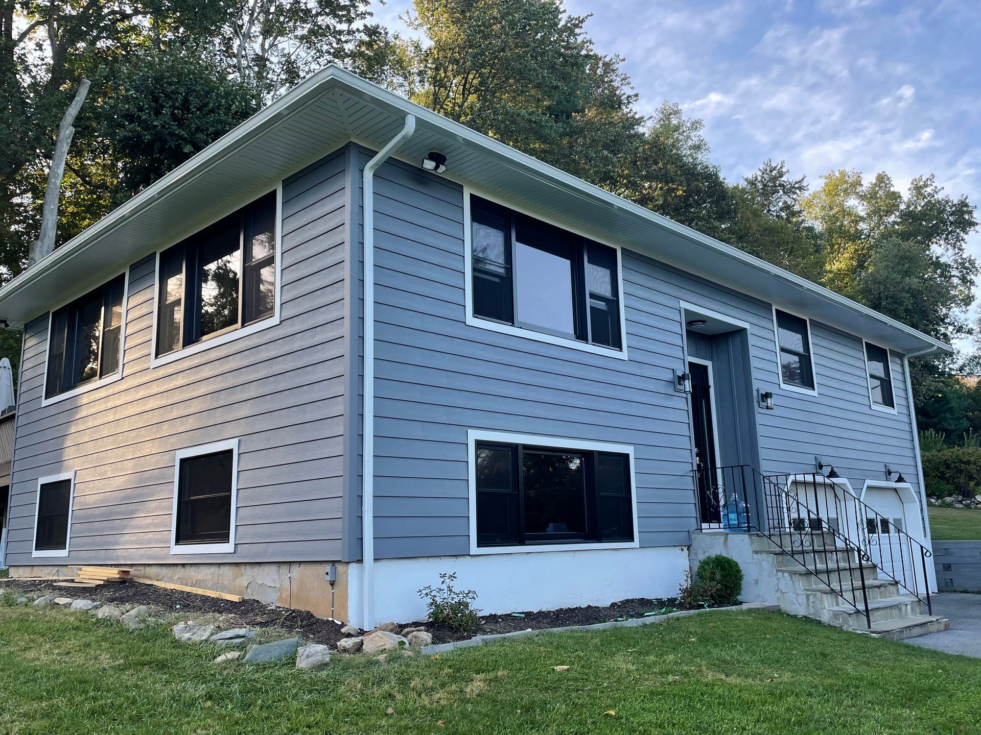 a large house with a lot of windows and stairs