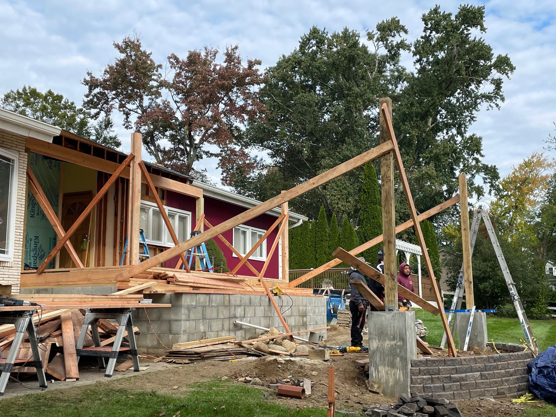 a house is being built with wooden beams and pillars