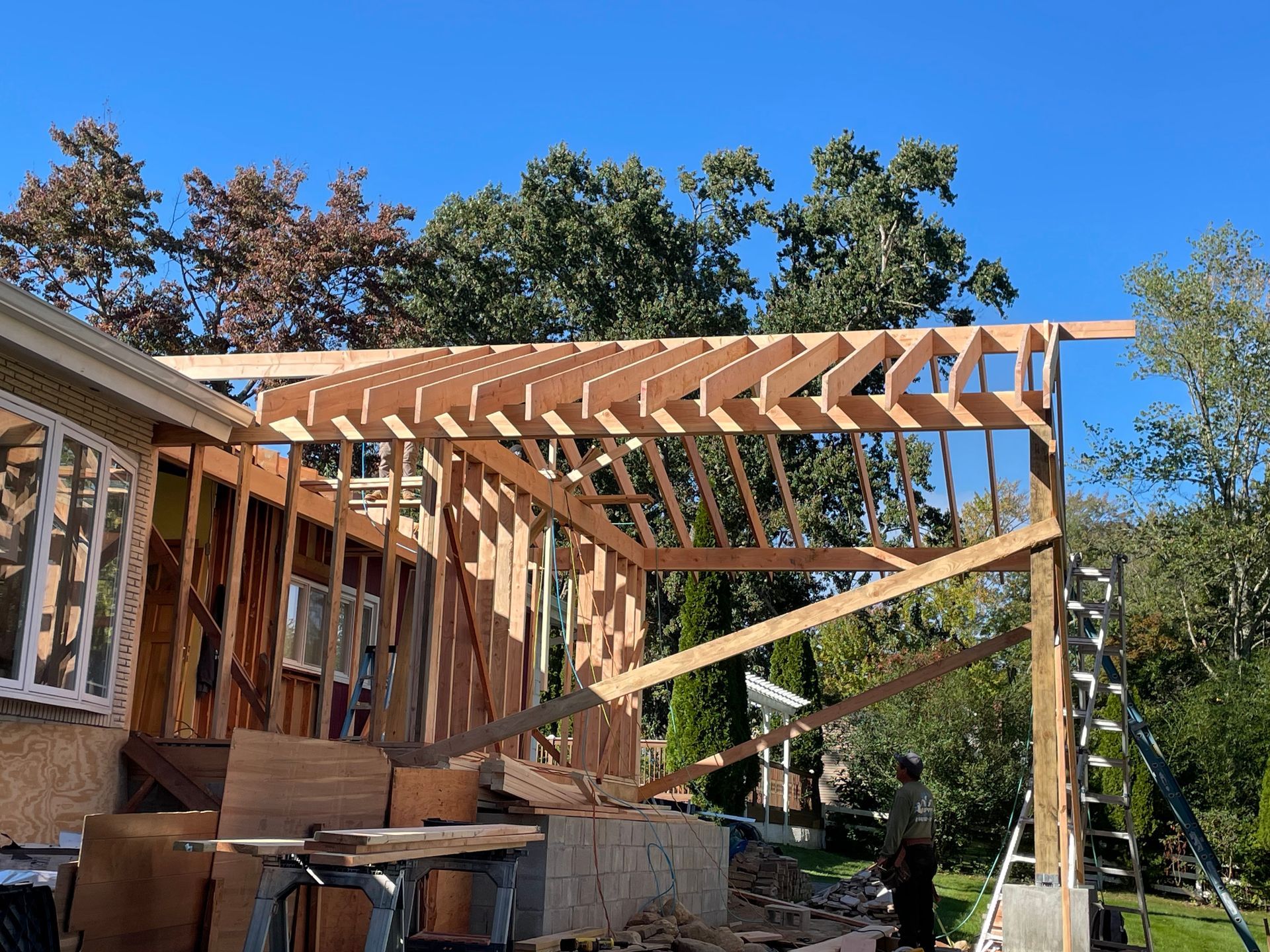 a wooden structure is being built on top of a house