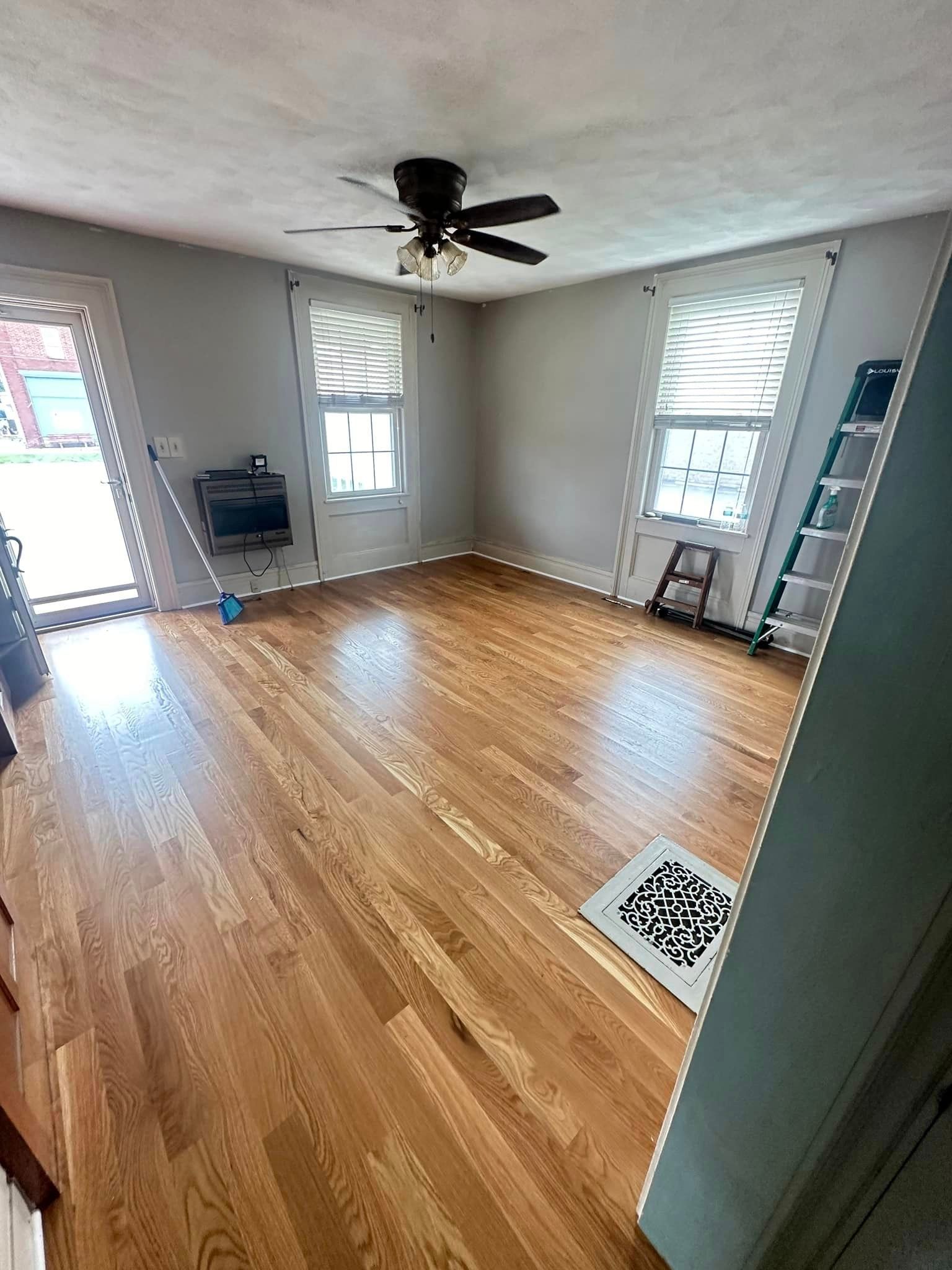 A living room with hardwood floors.