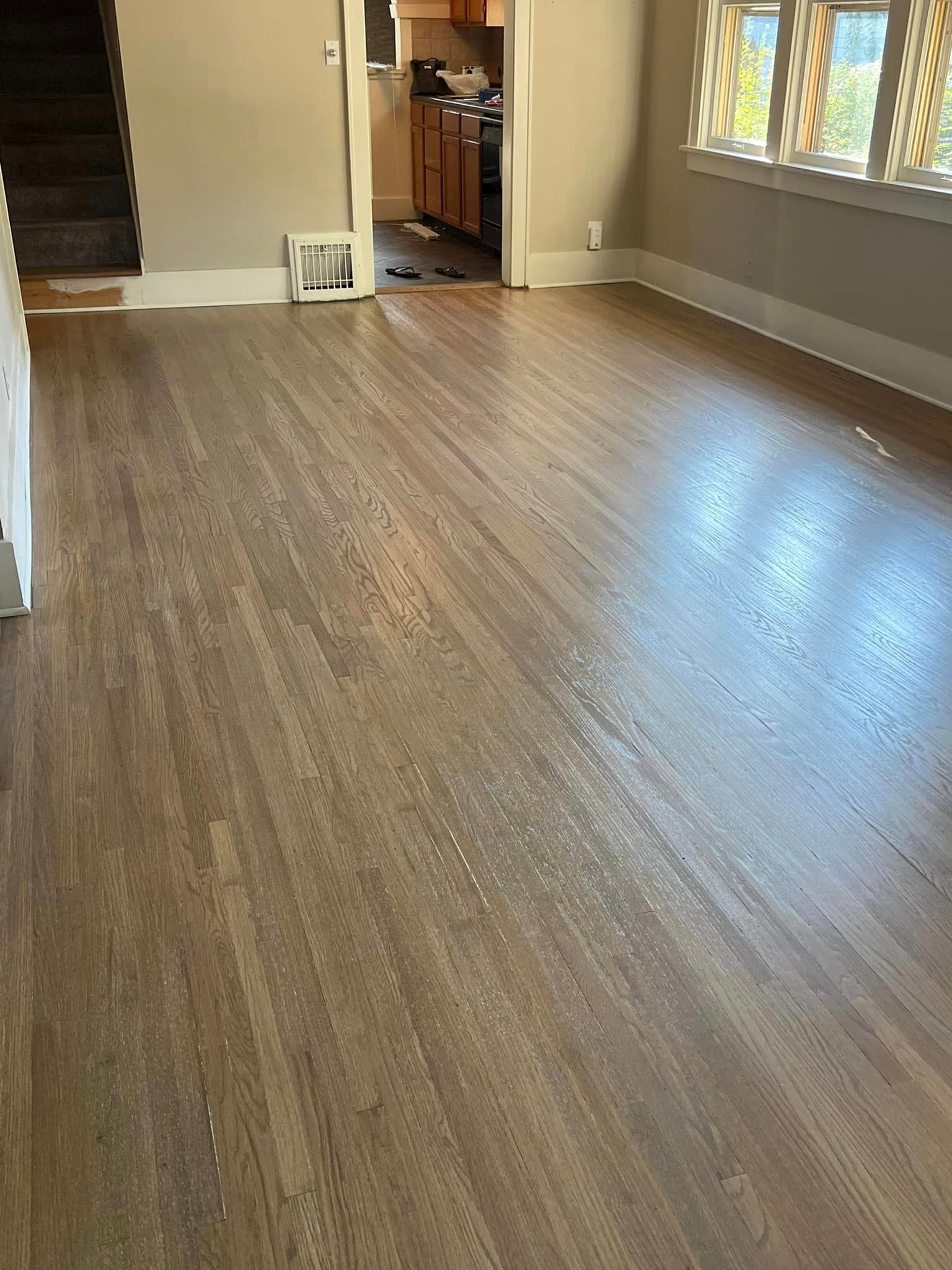 A living room with hardwood floors.