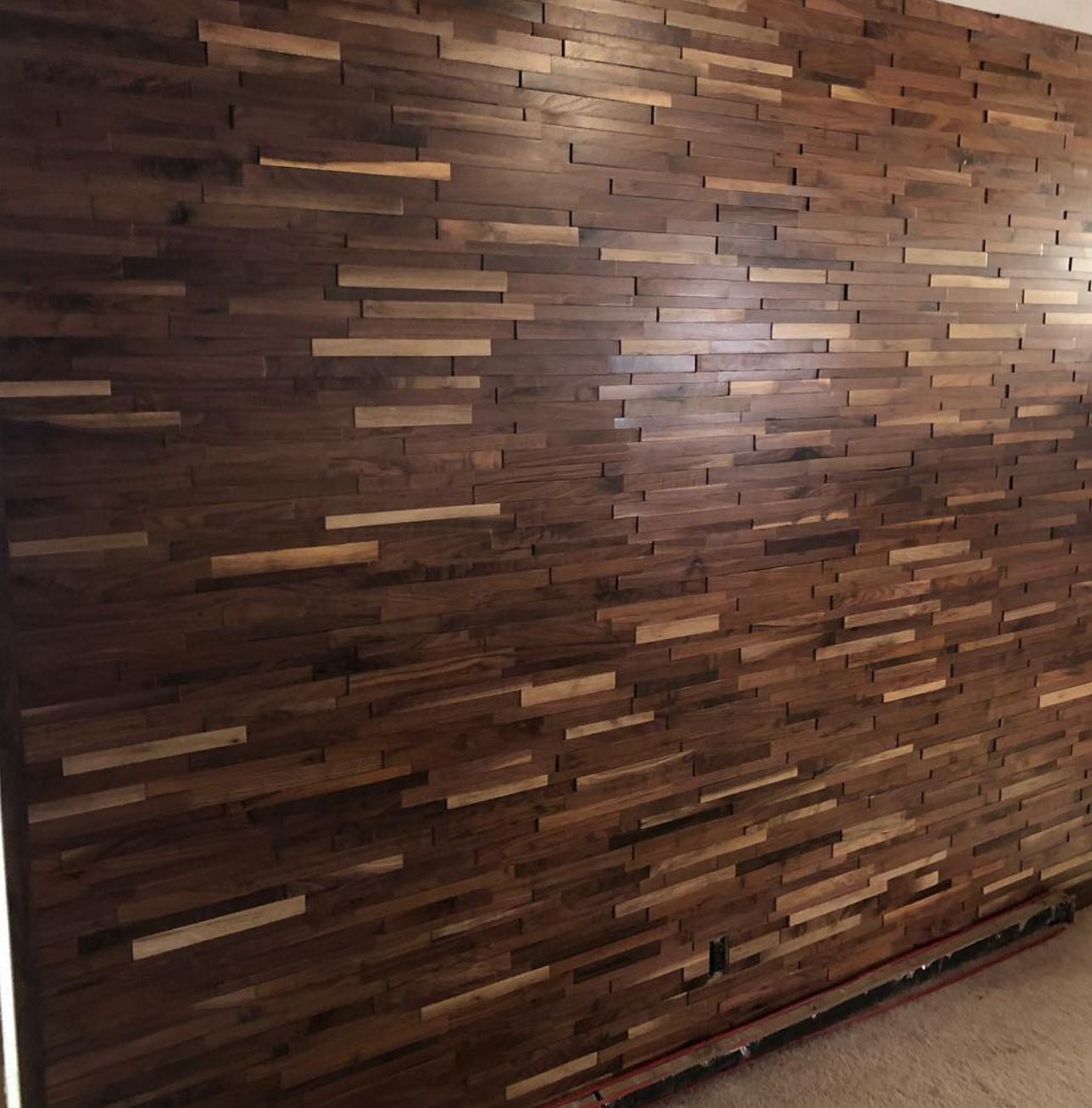 A large wooden wall in a room.