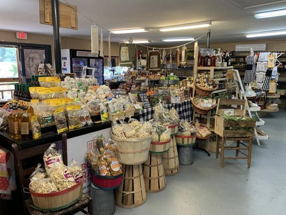 A store filled with lots of baskets and bags of food