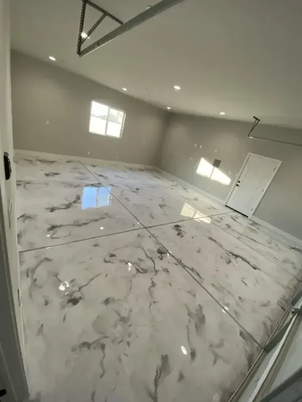 Empty modern room with glossy marble-look tile floor, recessed lights, and windows casting reflections