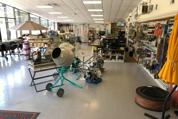 Interior of a hardware store, with various tools, supplies, and equipment on display.