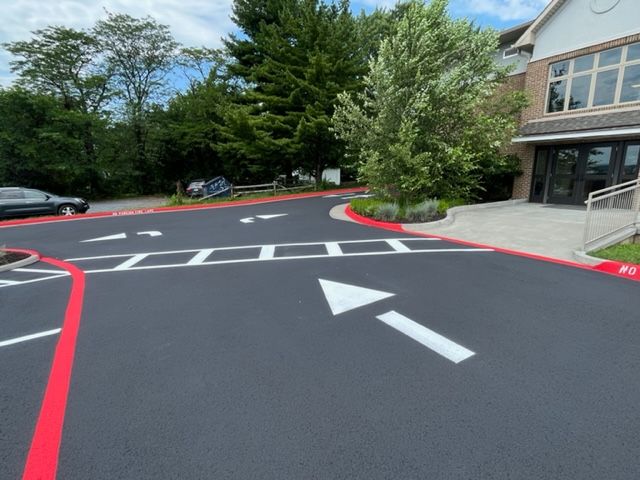 a parking lot with a white arrow pointing to the right