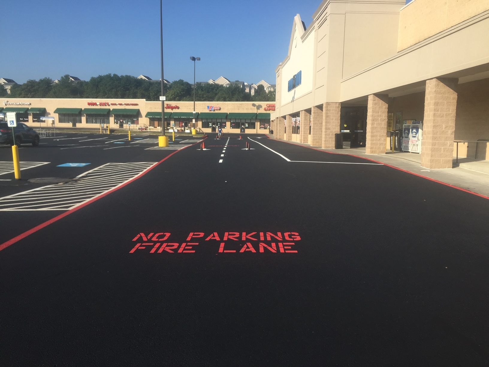 a parking lot with the words no parking fire lane painted on it