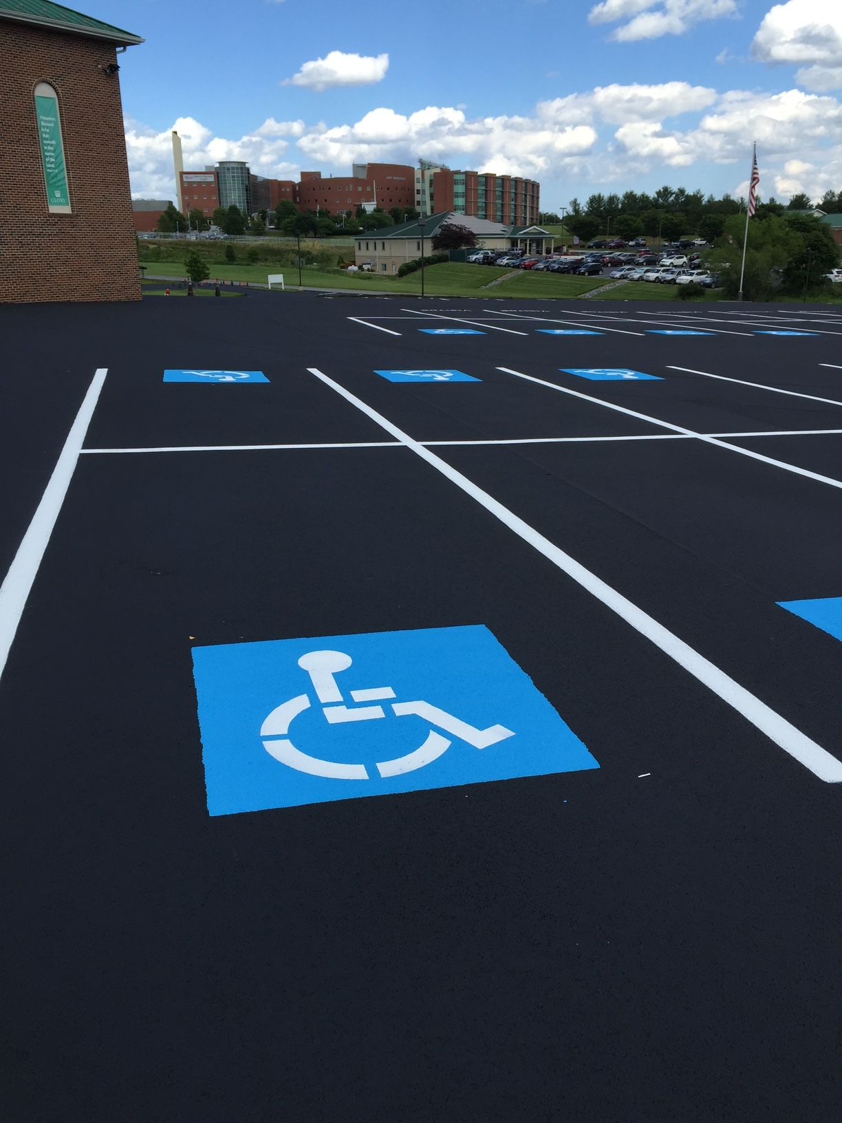 a parking lot with a handicap sign on it