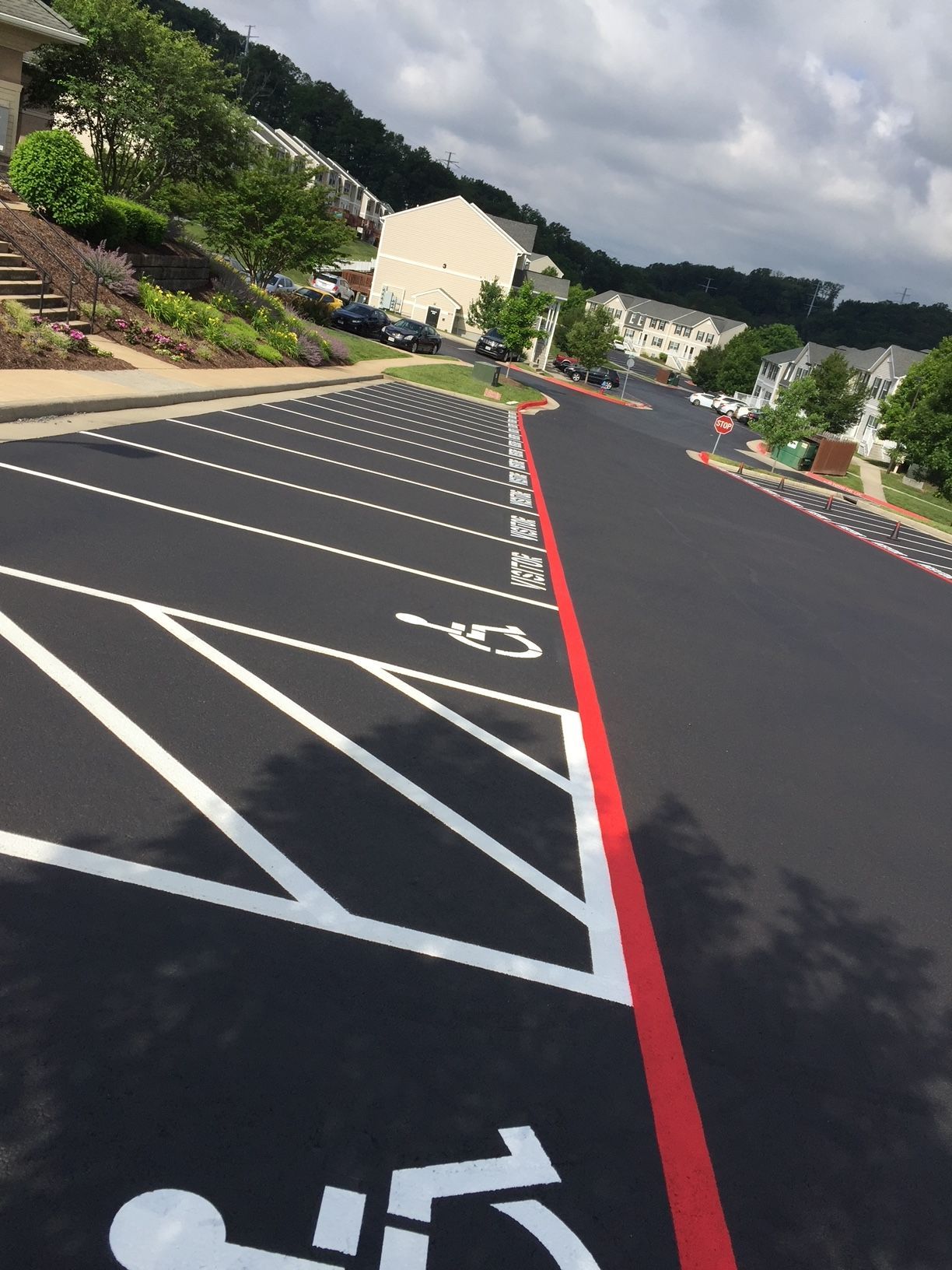 a parking lot with a handicap sign painted on it