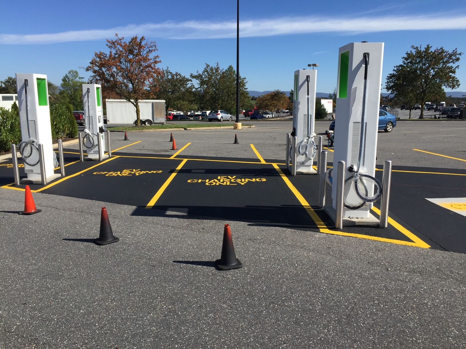a parking lot with a lot of charging stations