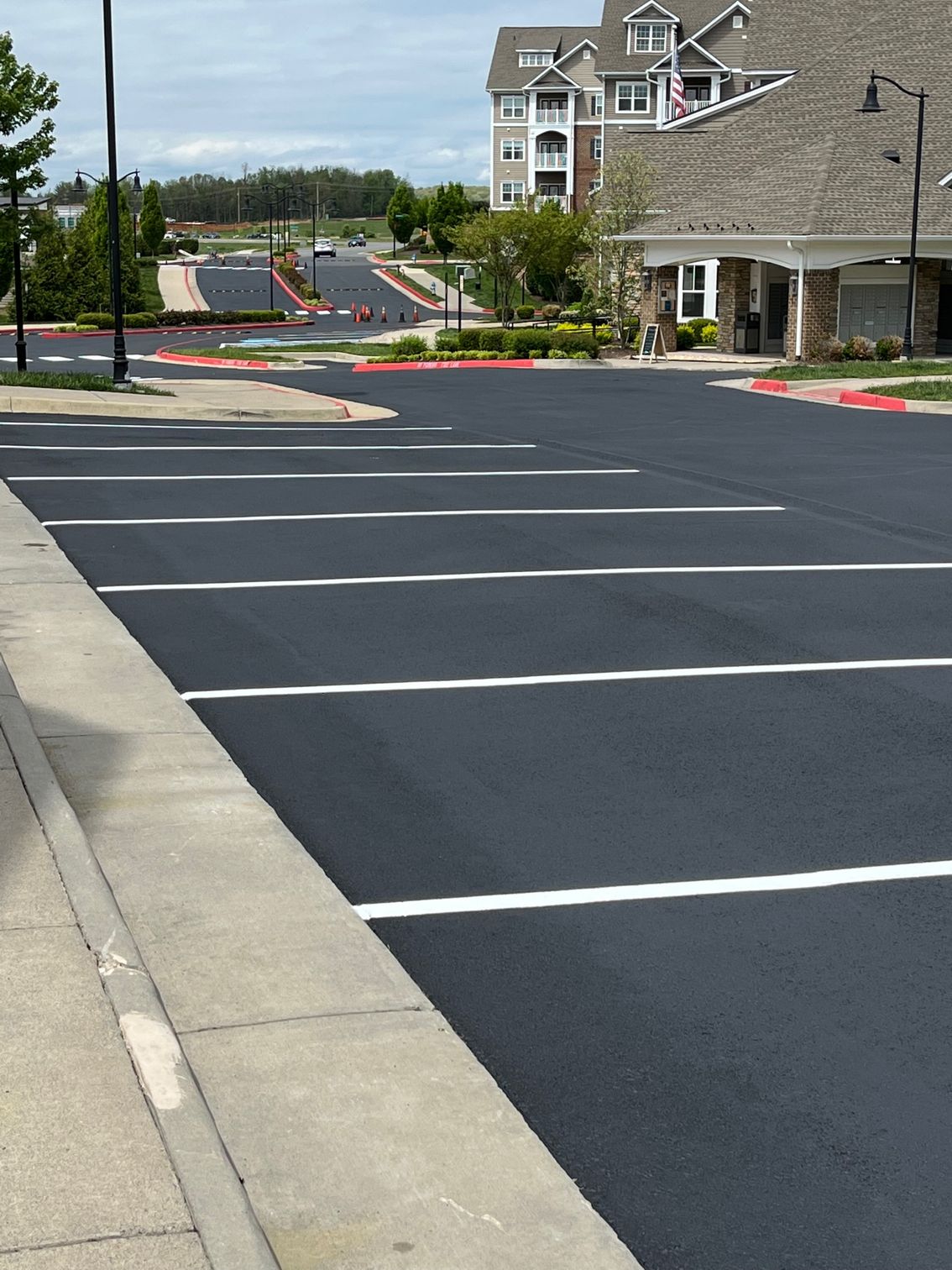 a parking lot with a building in the background
