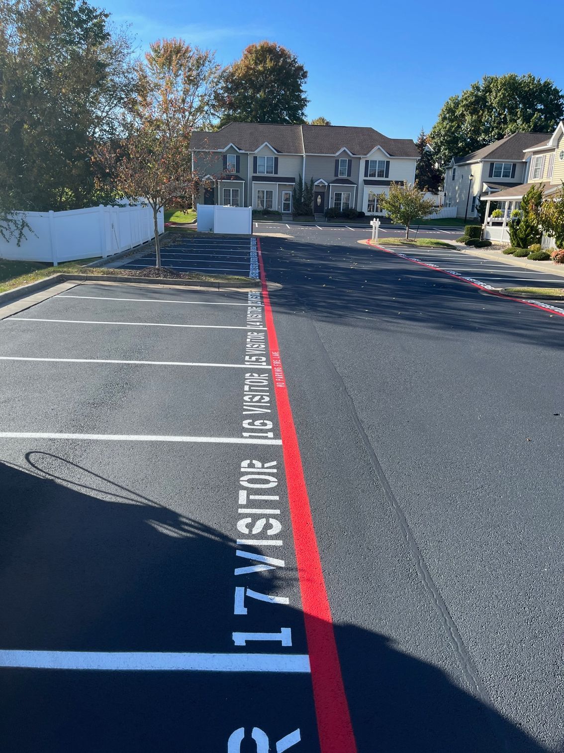 a parking lot with the word visitor painted on it