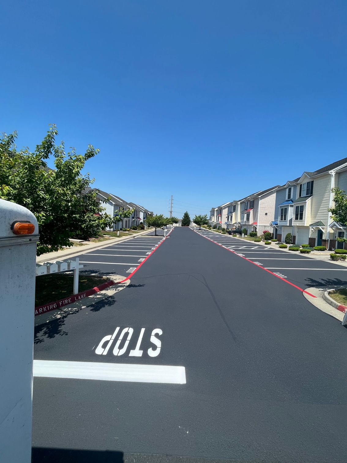 stop sign is painted on the side of a road