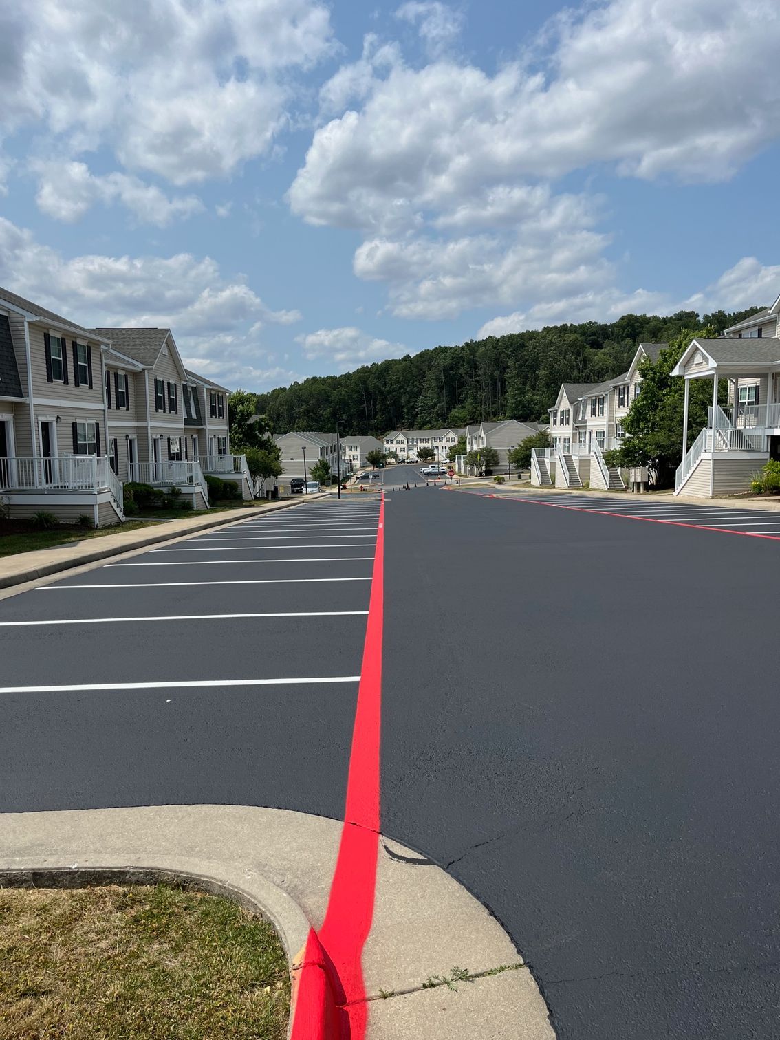 a red line is painted on the side of a road