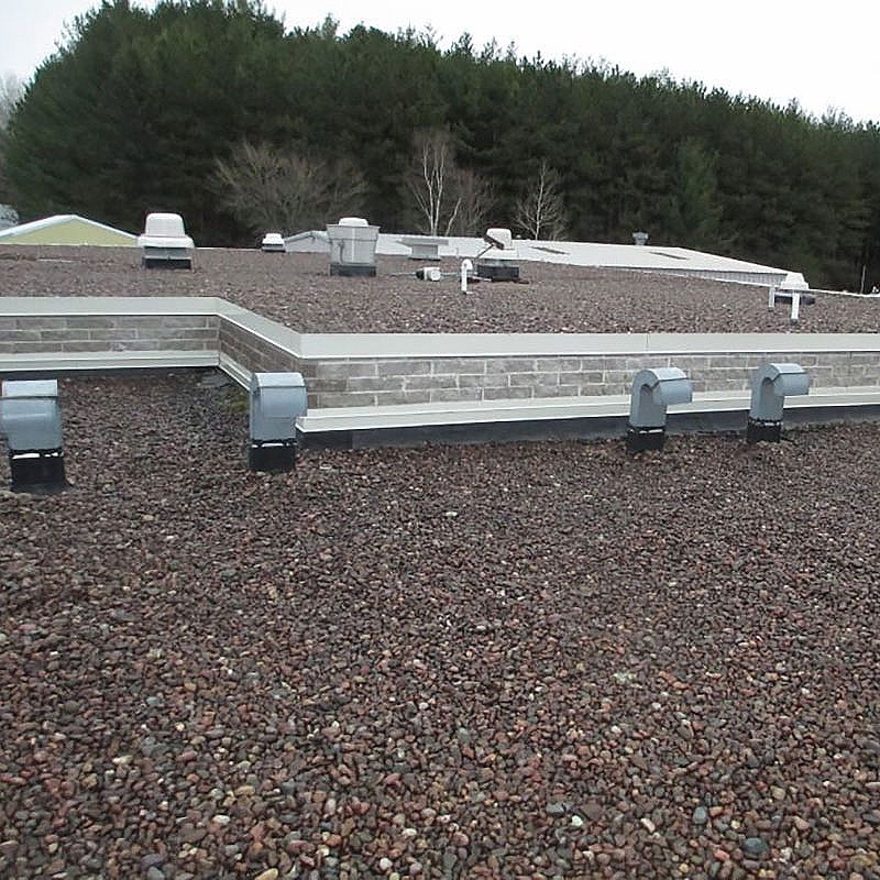 A roof with a lot of gravel on it