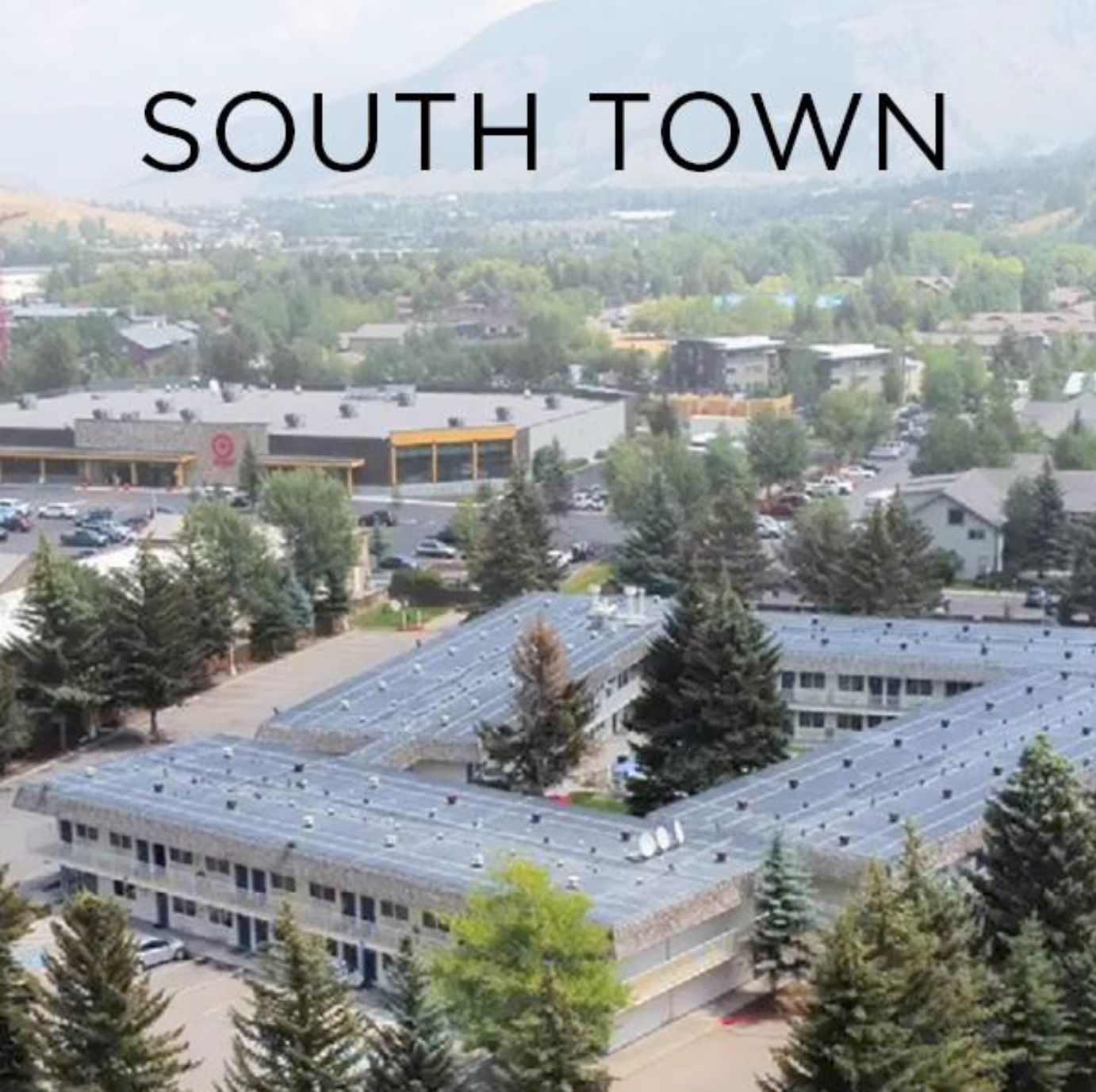 An aerial view of south town with buildings and trees