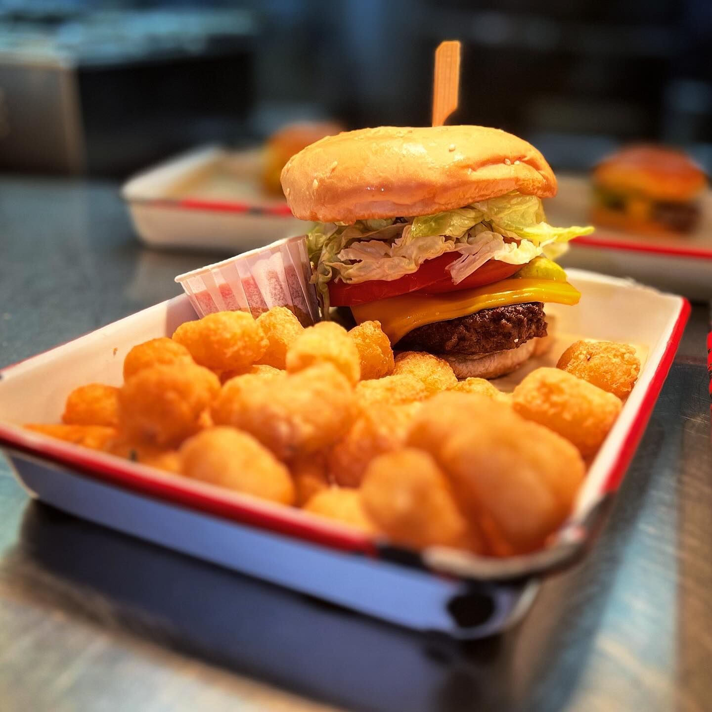 A bottle of guinness sits next to a glass of beer