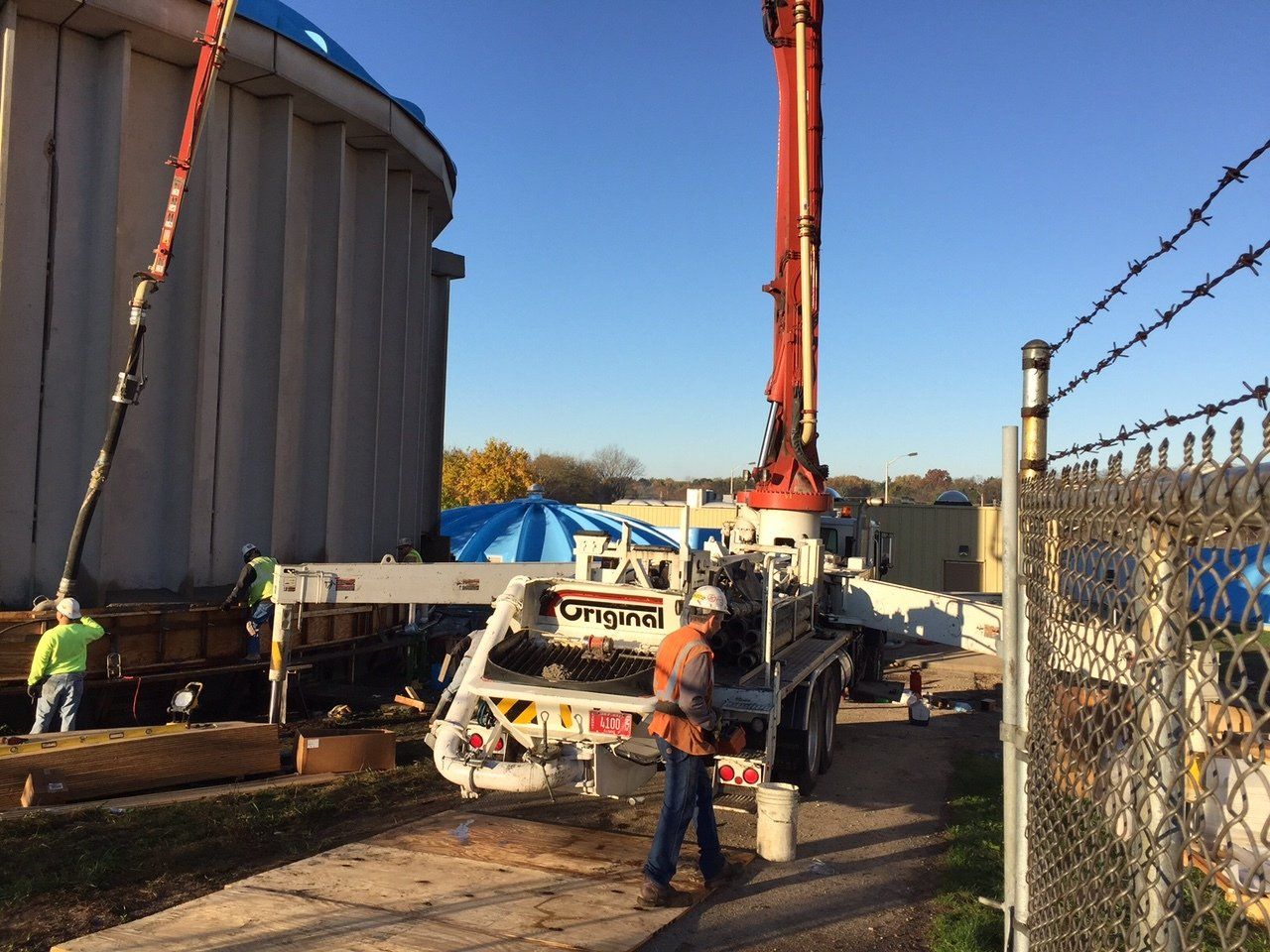 a man is standing in front of a crane
