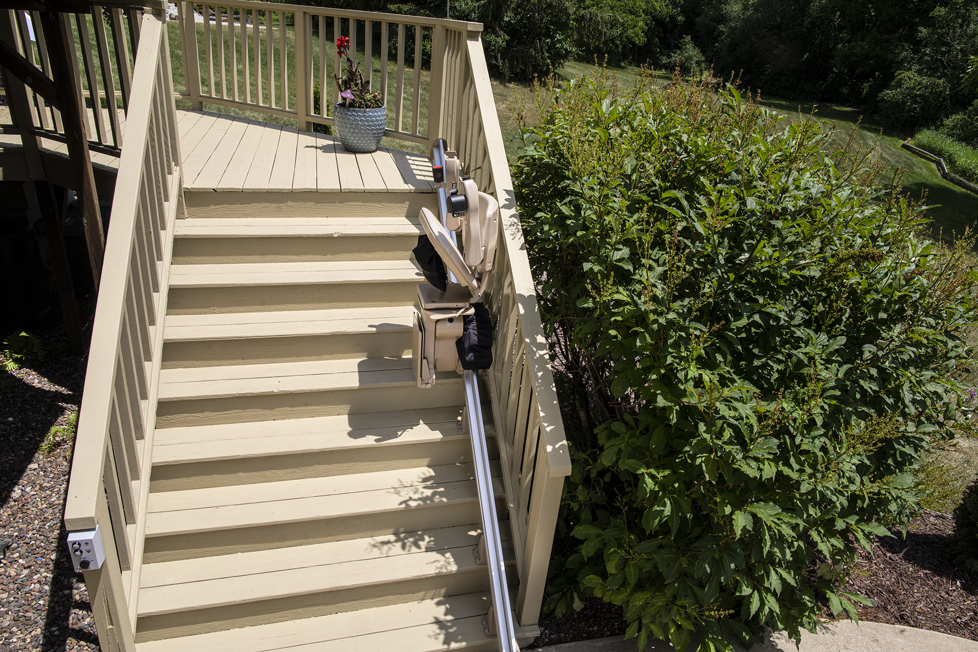 A wooden deck with stairs leading up to it