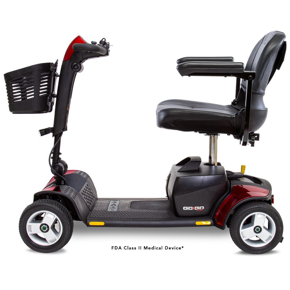 A red and black mobility scooter with a basket on the front.