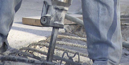 Breaking concrete using jackhammer