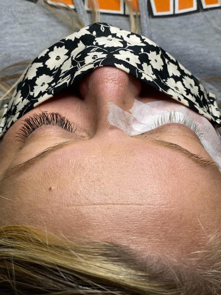 A close up of a woman 's face with a mask on.