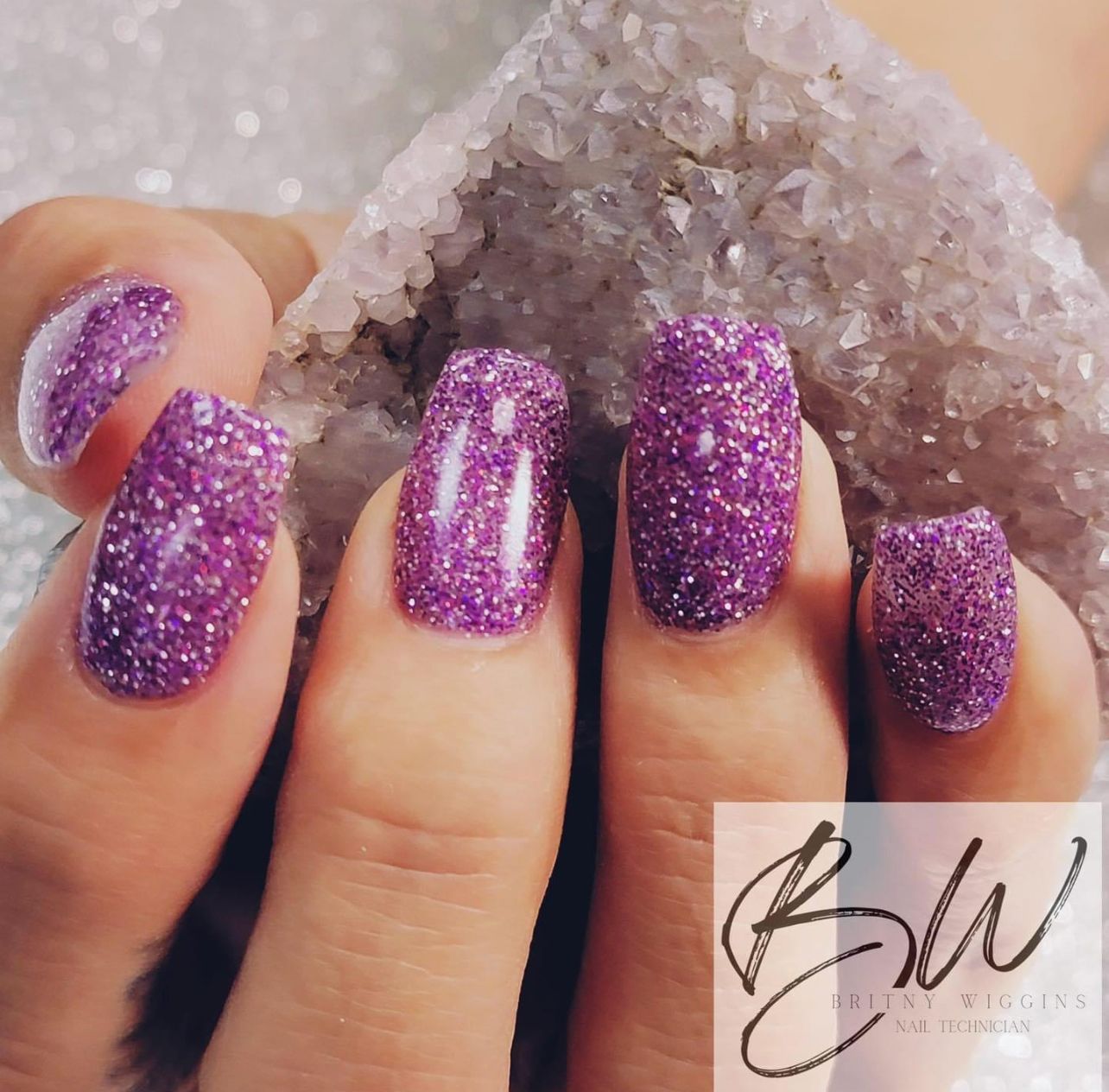 Glittered purple manicure