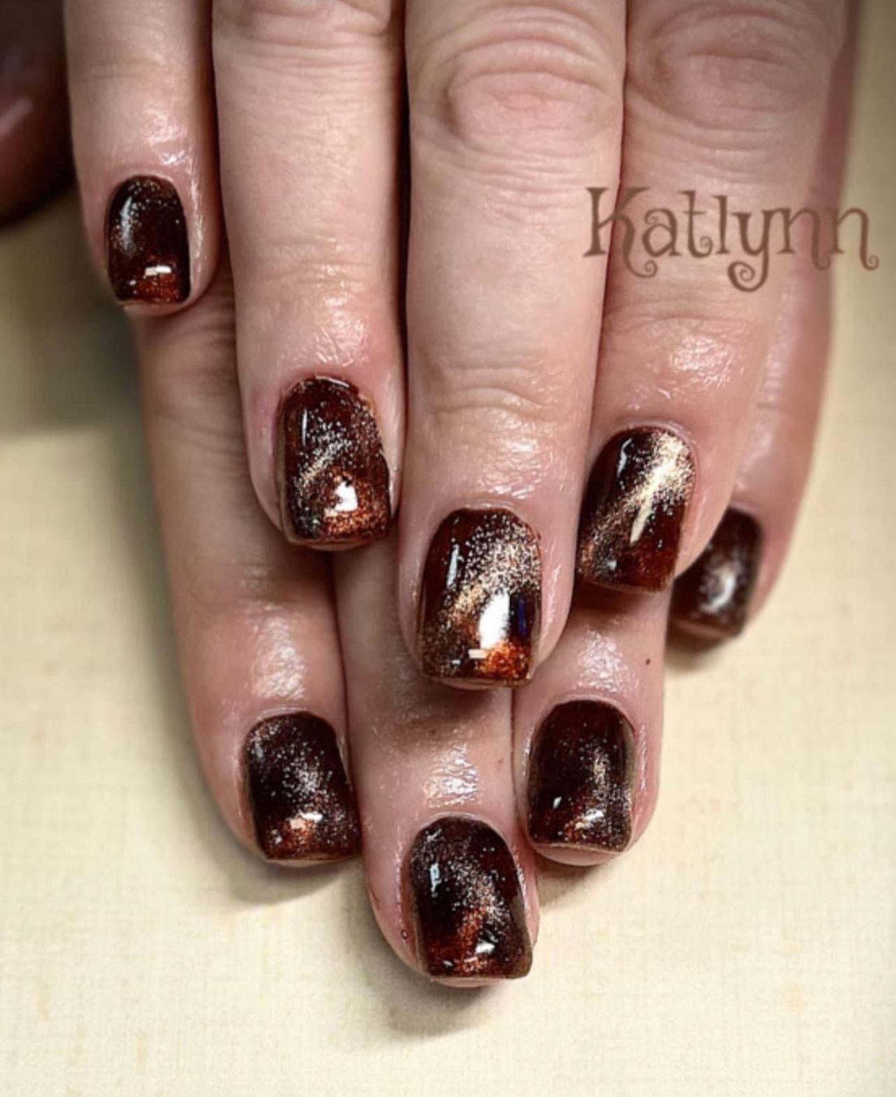 Maroon and gold nails