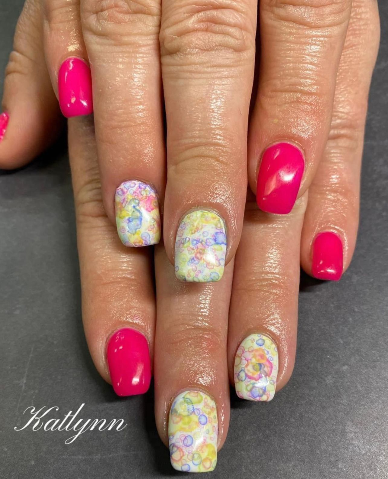 Pink and white colored nails