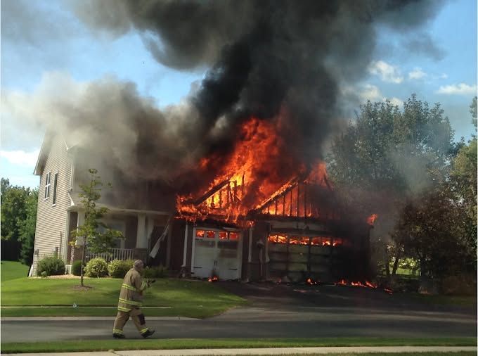 An overhead view of turquoise ocean waves crashing and forming white foam against deep blue water.