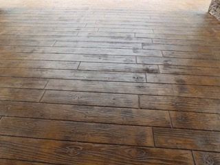 A close up of a wooden floor in a room.