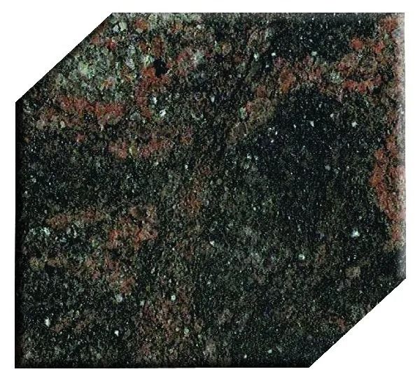 Dark speckled green-and-red stone tile with beveled corners