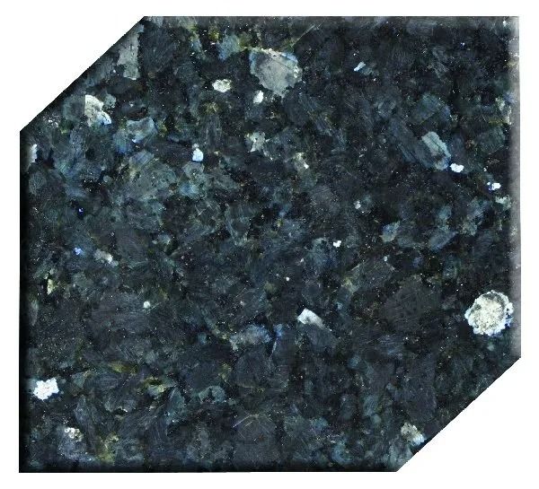 Dark speckled stone tile with white flecks and a beveled corner