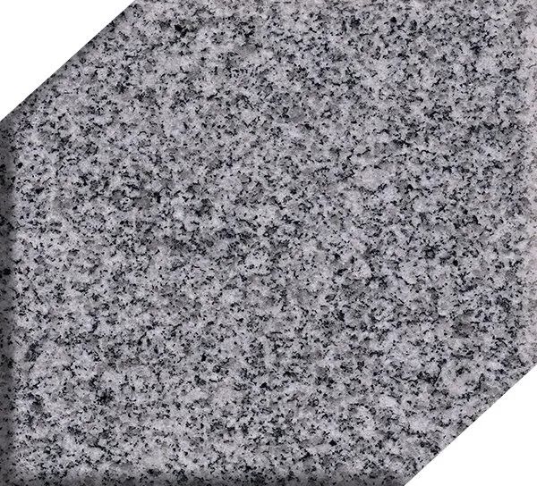 Gray speckled granite tile with a diagonal white corner on the lower right
