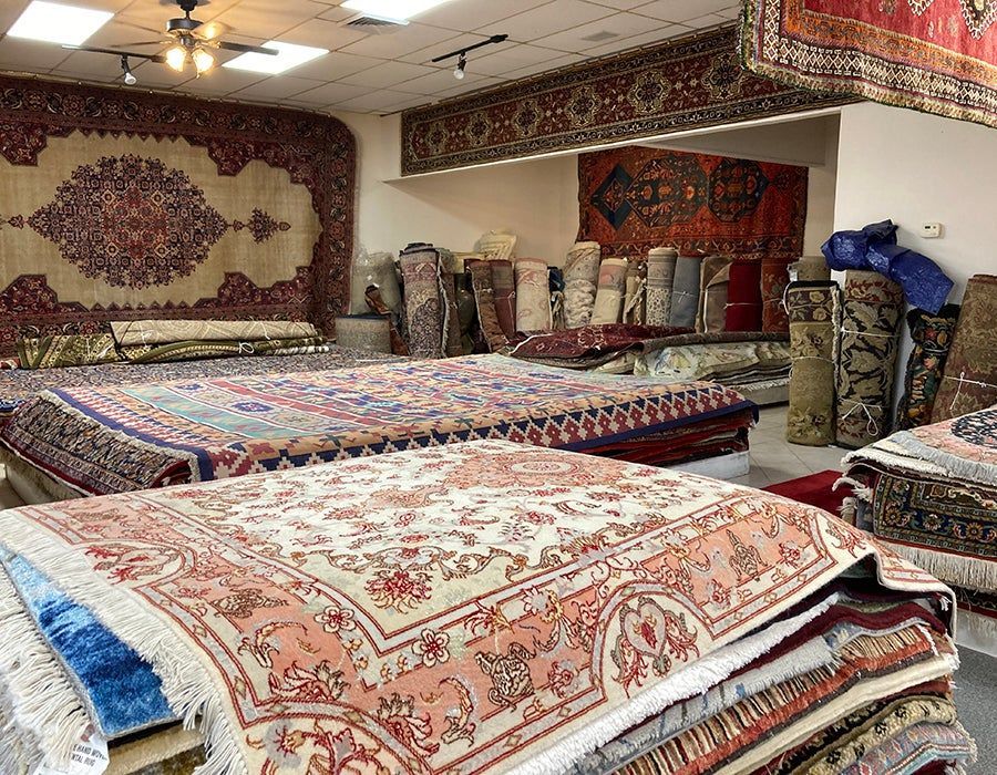 A room filled with lots of rugs and carpets.