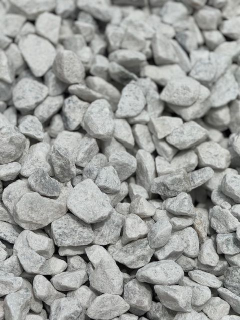 A pile of white rocks is sitting on a table.