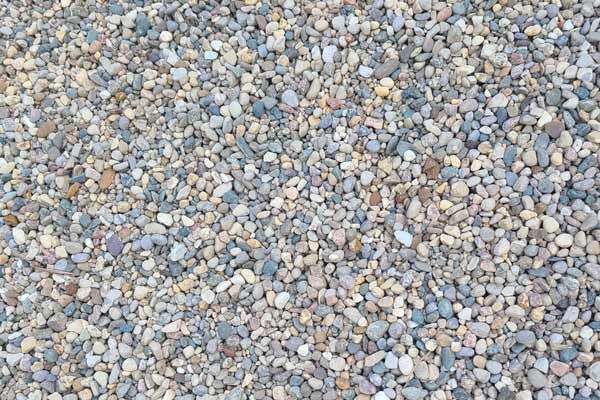 A pile of gravel is sitting on the ground.