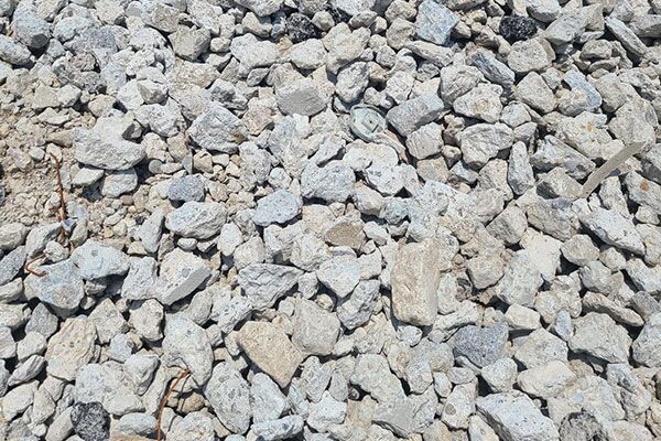 A pile of wood chips is sitting on the ground.