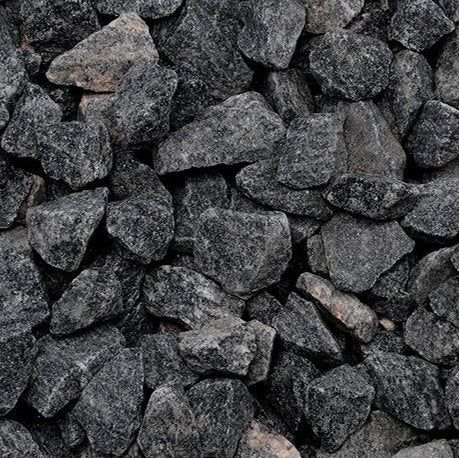 A close up of a pile of black granite.