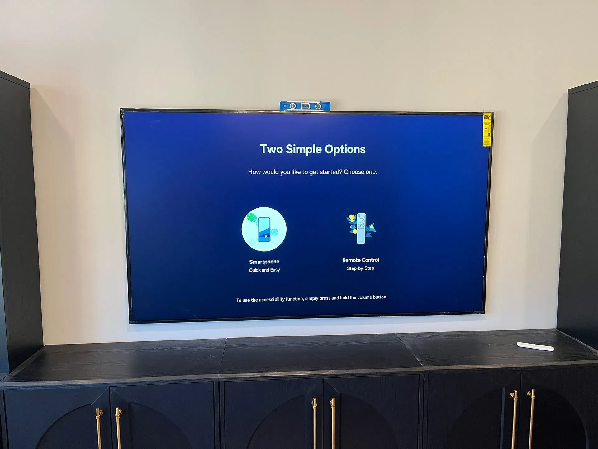 A wall-mounted screen displaying a 
