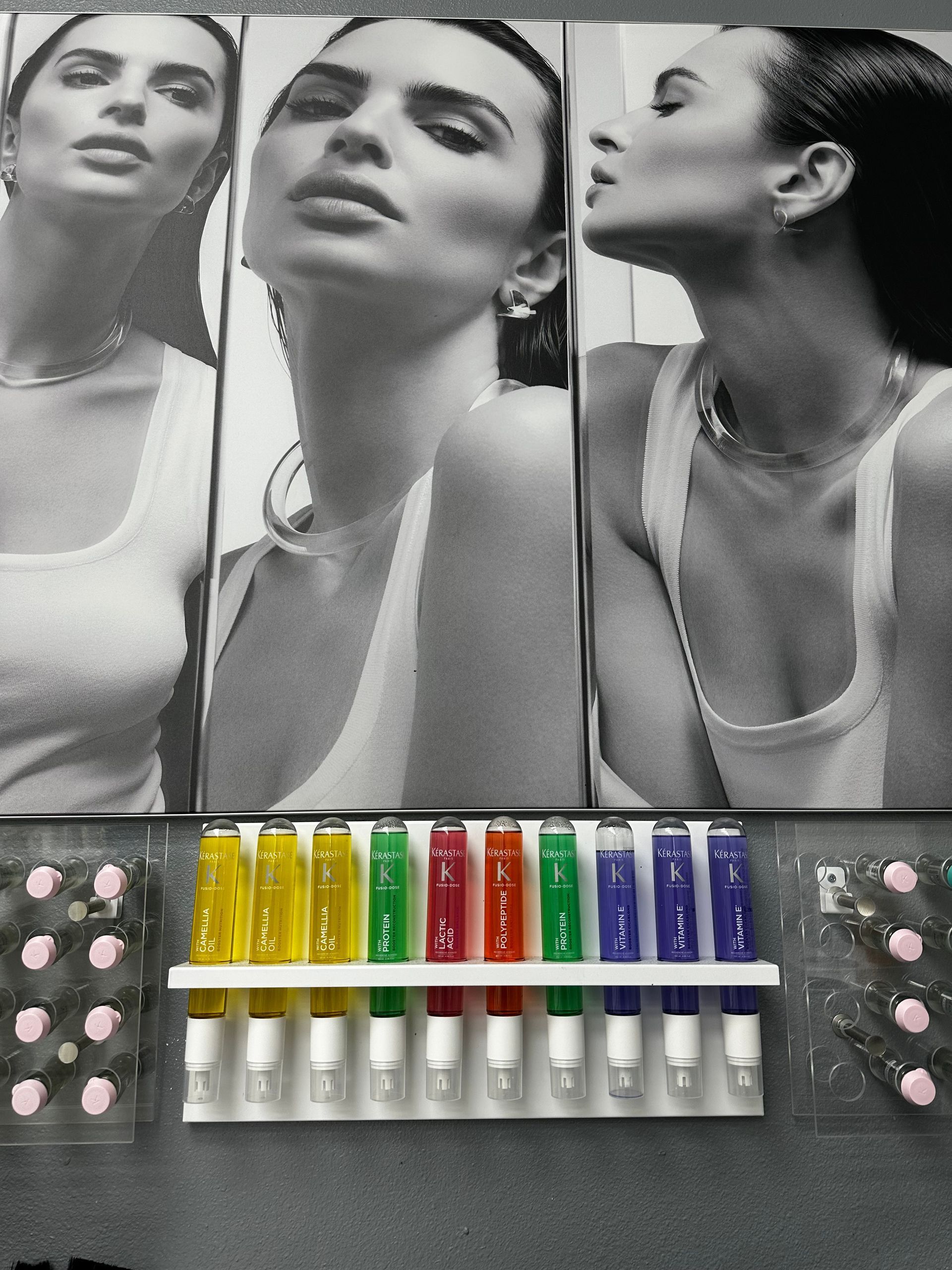 A black and white photo of a woman in a tank top