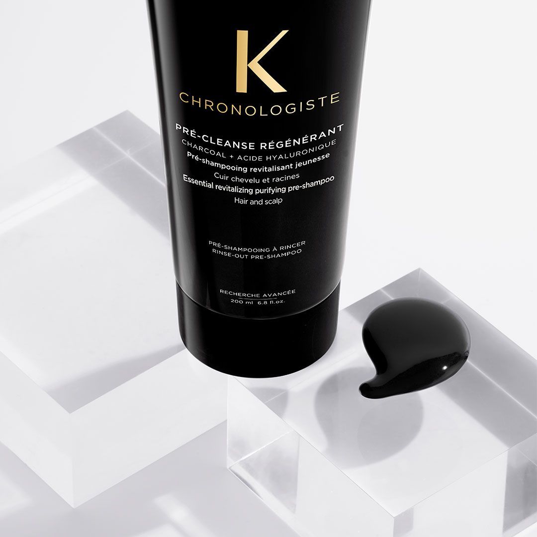 A black bottle with the letter k on it