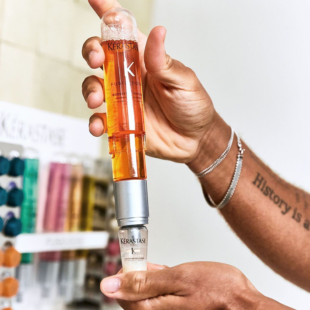 A person with a tattoo on their arm that says history is