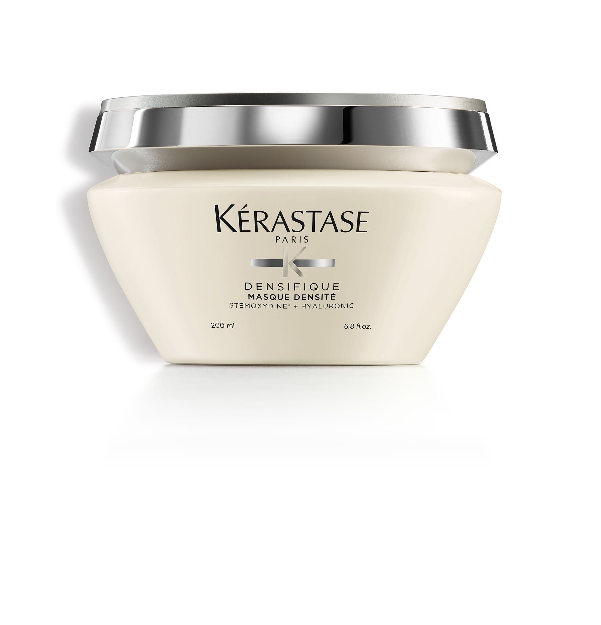 A jar of Kérastase hair product on a white background