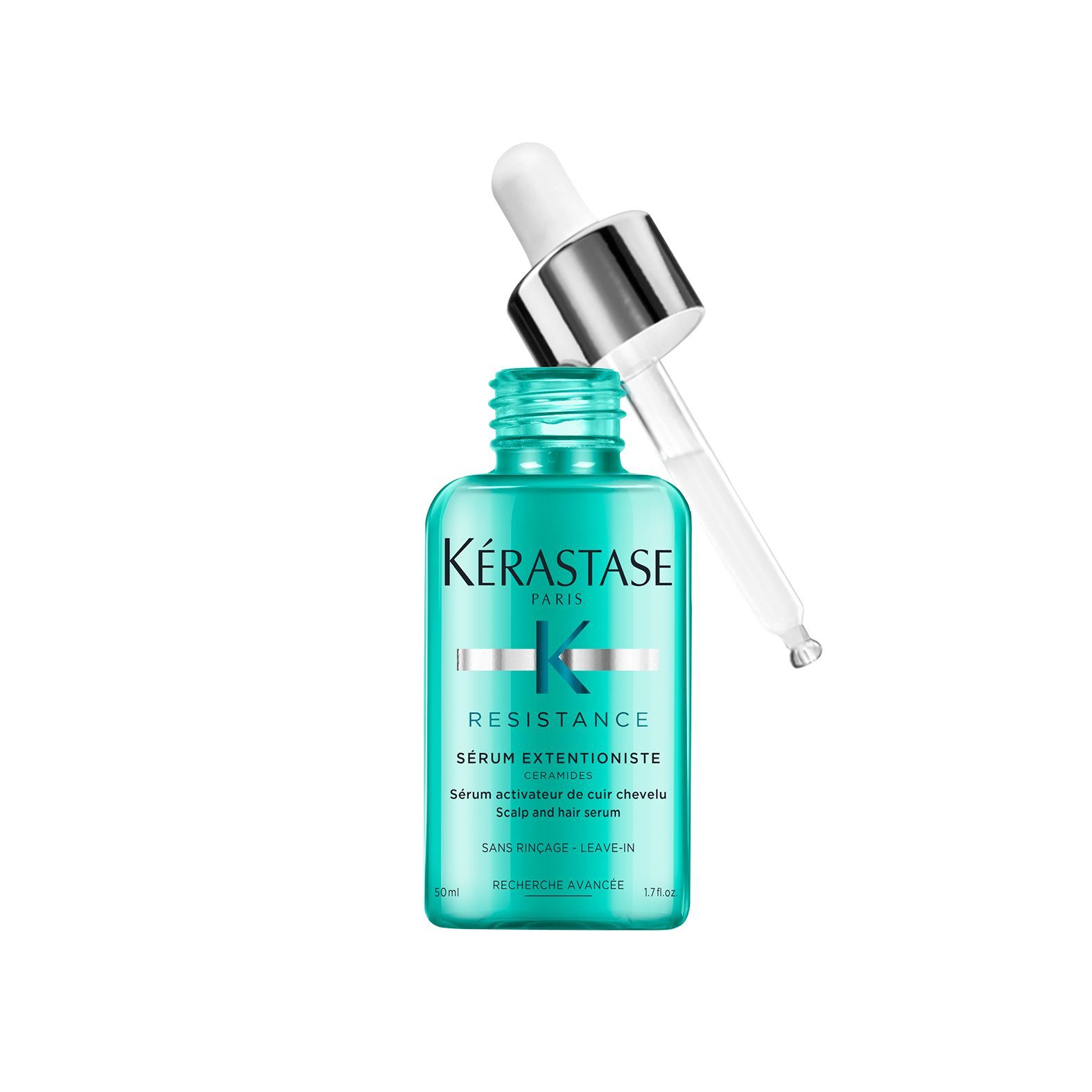 A bottle of Kérastase hair serum with a dropper on a white background