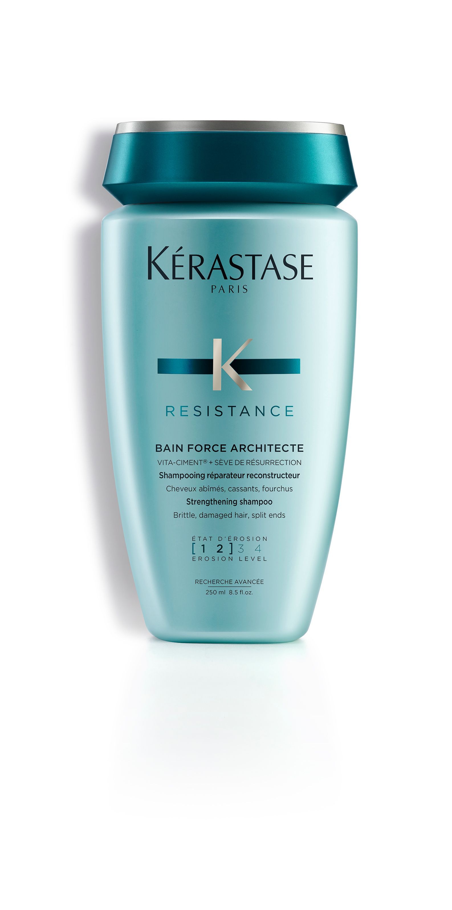 A bottle of Kérastase shampoo on a white background