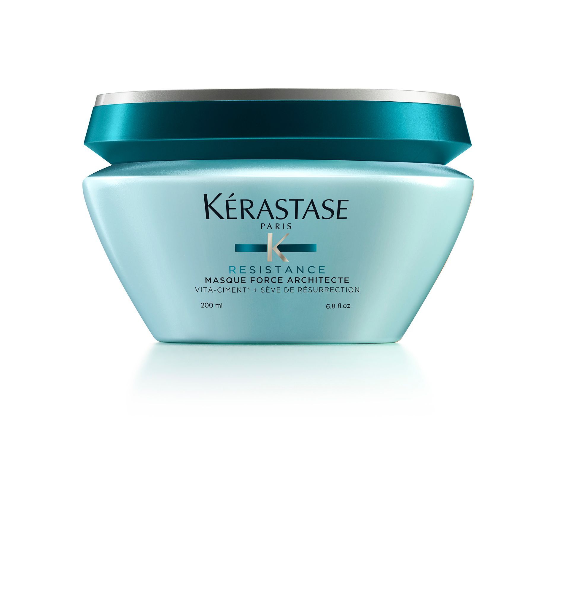 A jar of Kérastase hair product on a white background