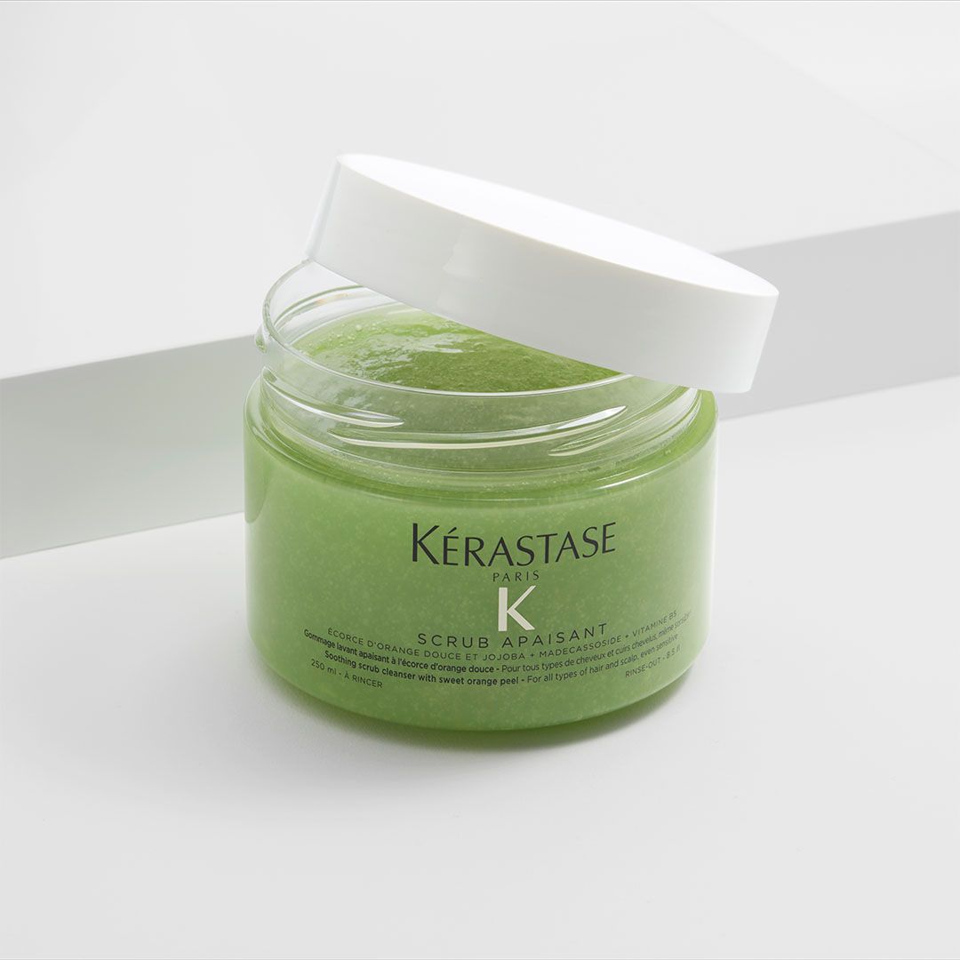 A jar of Kérastase is sitting on a table