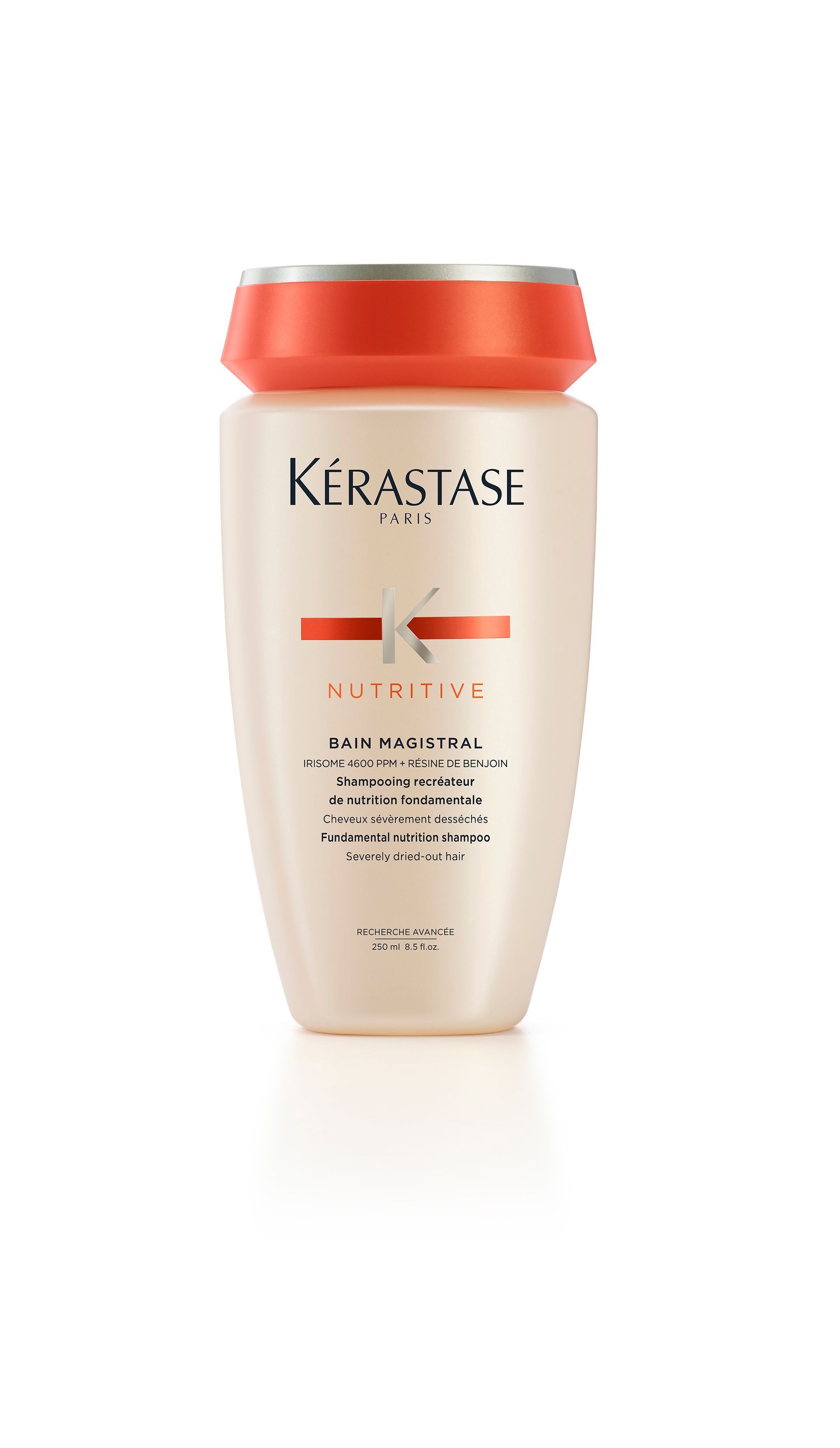 A bottle of Kérastase shampoo on a white background