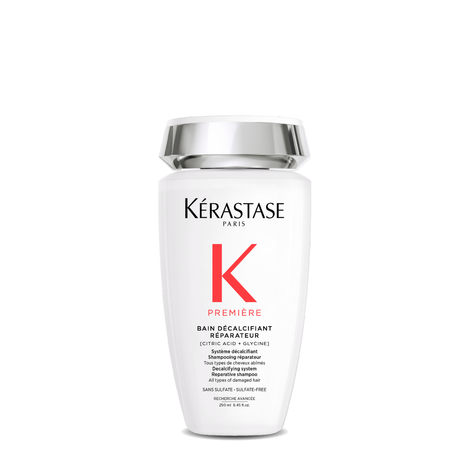 A white bottle of Kérastase shampoo with a red K on it